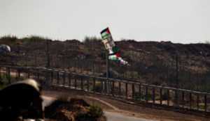 Nazi flag Gaza “Palestinian” rioters at Gaza/Israel border throw rocks and firebombs at IDF troops, raise Nazi flag