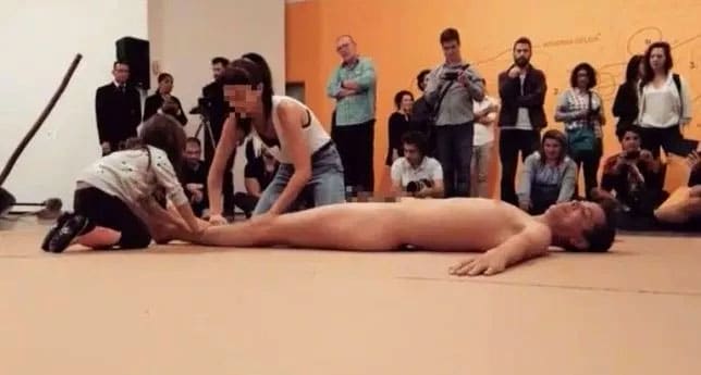 Footage showing a four-year-old child being encouraged to touch a naked man’s body for a performance art stunt has sparked outrage in Brazil.