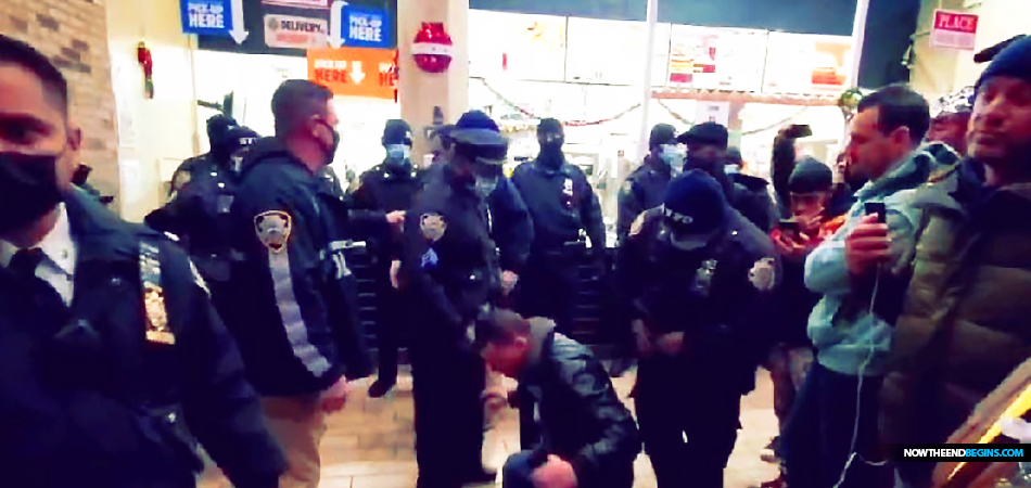 Five maskless, unvaccinated protesters wound up in handcuffs Monday night after attempting to order food at a Downtown Brooklyn Burger King, apparently in opposition to the city’s COVID protocol. The arrest of the unvaccinated has begun in New York City, and it will only increase across the country in the coming days and weeks. Everywhere you have mask and vaccine mandates, you can expect to see the unmasked and the unvaccinated arrested and brought to criminal, not civil, court. America is firmly in the hands of wicked rulers whose power will only increase and become more intrusive and destructive. “When the righteous are in authority, the people rejoice: but when the wicked beareth rule, the people mourn.” Proverbs 29:2 (KJB) On January 10th on the Prophecy News Podcast, we will celebrate Day 666 of 15 Days To Flatten The Curve, which just coincidentally is the very day when Biden vaccine mandate penalties are set to start terrorizing employers. 2022 will be the roughest year on so far, unless of course, you are willing to lay down before the government, and receive their sacrament of vaccination injection a minimum of 3 times. What is happening right now is not politics and it’s not science, it is religion, and if you don’t convert you will be burned at the stake. Sound familiar? The Bible has warned you for 2,000 years about the coming One World Religion, and you are watching to all come together in front of your face.
