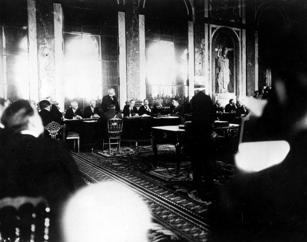 On this date in 1919: Allied leaders and officials gather in the Hall of Mirrors at the Palace of Versailles for the signing of the Treaty of Versailles. There to sign the treaty are Allied leaders French Premier George Clemenceau, standing, center; U.S. President Woodrow Wilson, seated at left; Italian Foreign Minister Giorgio Sinnino; and British Prime Minister Lloyd George. 