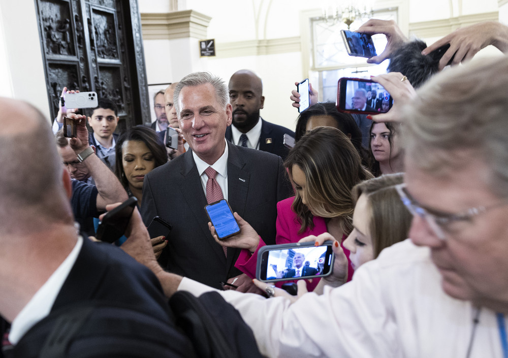Speaker of the House Kevin McCarthy surrounded by reporters as he arrives at the Capitol today. 