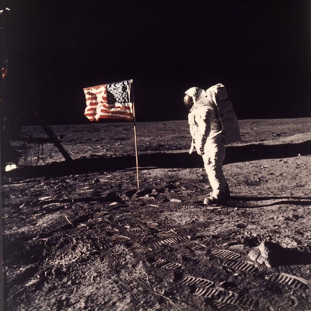 Astronaut Edwin E. "Buzz" Aldrin Jr.  poses for a photograph beside the U.S. flag deployed on the moon during the Apollo 11 mission
