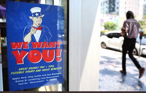 A 'We Want You!' sign is posted at an Ike's Love & Sandwiches store in Los Angeles, Calif. 