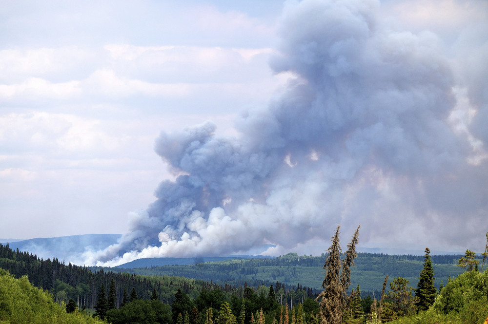 Smoke billows from the Donnie Creek wildfire burning north of Fort St. John in British Columbia, Canada on July 2.