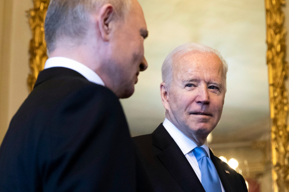 Joe Biden and Vladimir Putin are pictured in Switzerland.