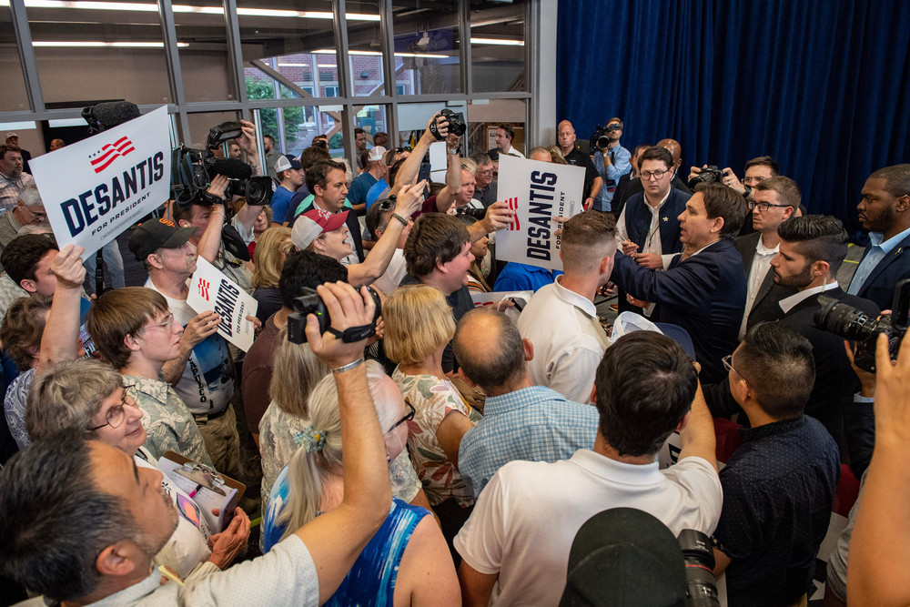 Florida Gov. Ron DeSantis signs autographs after speaking during a campaign stop at Manchester Community College in Manchester, New Hampshire, on Thursday.