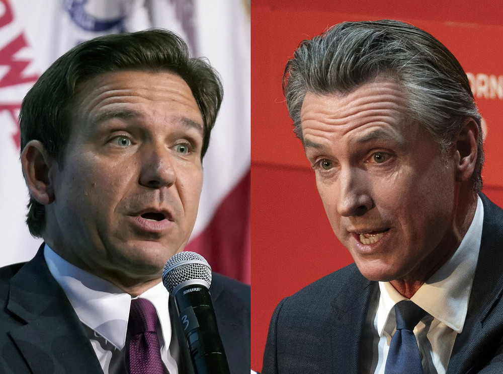 In this combination of photos, Republican presidential candidate Florida Gov. Ron DeSantis speaks on Sept. 16, 2023, in Des Moines, Iowa and California Gov. Gavin Newsom speaks on Sept. 12, 2023, in Sacramento, Calif. 