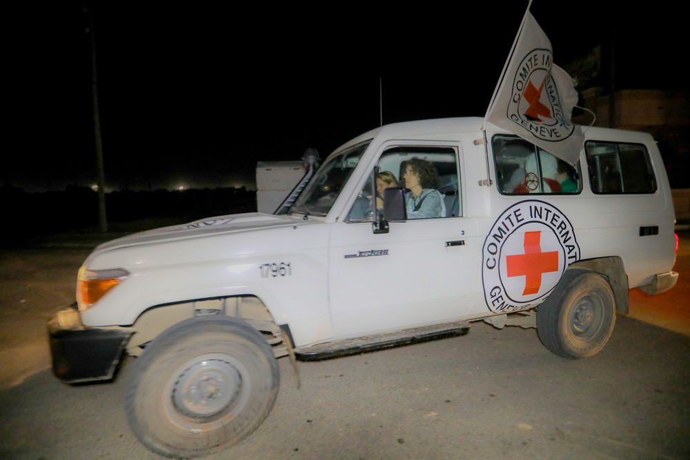 Hostages are transported in International Committee of the Red Cross vehicles from the Gaza Strip through the Rafah land crossing today. 