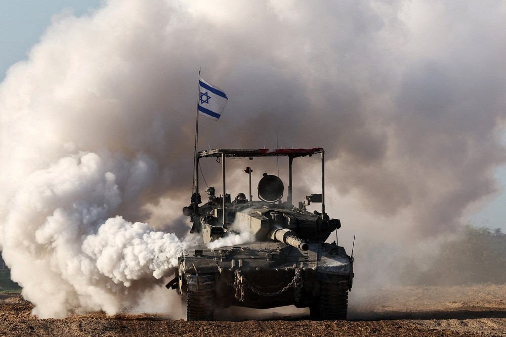 An Israeli army tank rolls in southern Israel along the border with the Gaza Strip.