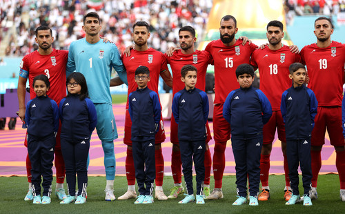 Iran players line up for the national anthem prior to their World Cup match against England.