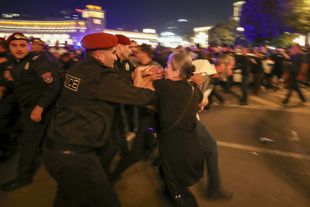 A demonstrator clashes with police at Republic Square to protest against Armenian Prime Minister Nikol Pashinyan today. Protesters gathered in central Yerevan, the capital of Armenia, blocking streets and demanding that authorities defend Armenians in Nagorno-Karabakh.