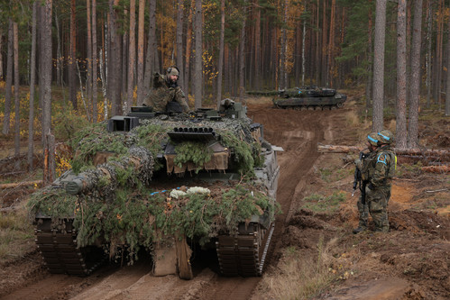 German tanks and soldiers during a NATO military exercise.