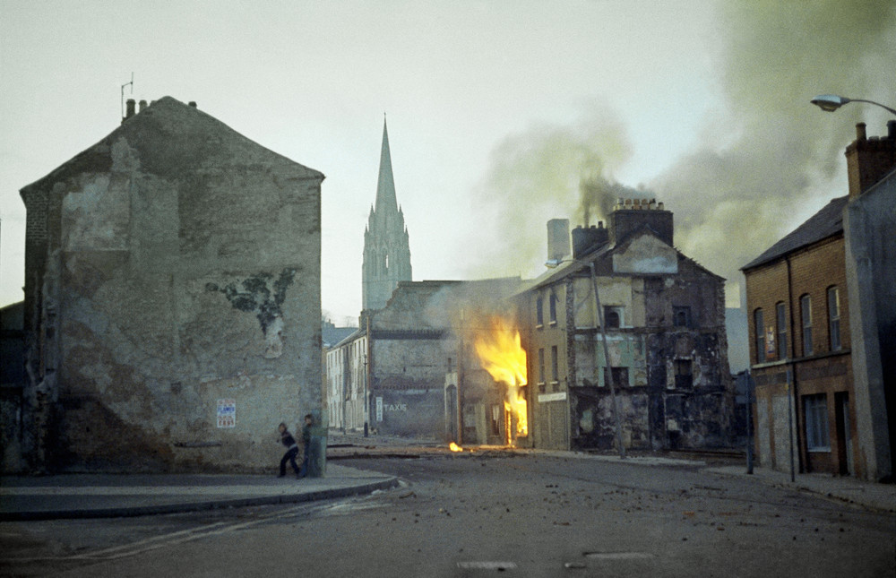 On this date in 1972: British soldiers shot 26 unarmed civilians and killed 14 during a civil rights protest in the Bogside district of Londonderry, Northern Ireland. The incident, which came to be known as Bloody Sunday, sparked widespread protest and further Irish nationalist hostility towards the British Army. Pictured here is a building burning in the Bogside in the aftermath of the event.