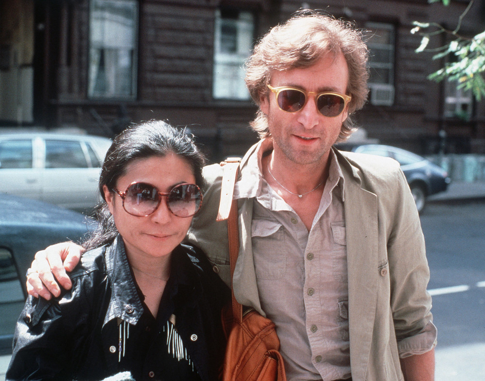 On this date in 1980: John Lennon is shot and killed in the archway of the Dakota, his residence in New York City. Pictured is Lennon and his wife Yoko Ono in August 1980, arriving at The Hit Factory, a recording studio in New York City. 