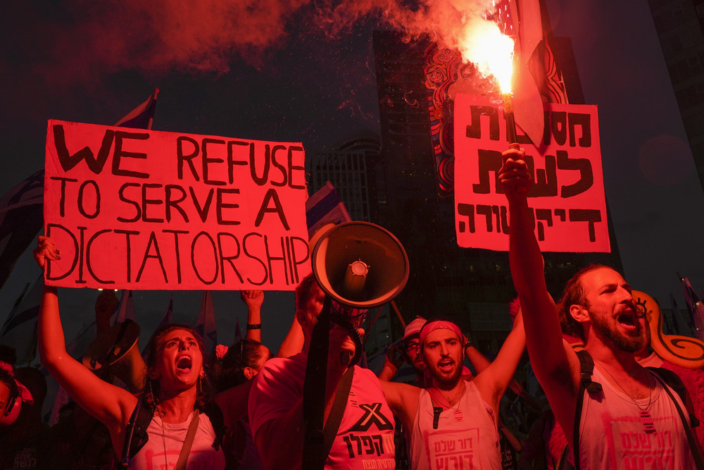 Israelis protest against plans by Prime Minister Benjamin Netanyahu's government to overhaul the judicial system in Tel Aviv, Israel on July 29. 