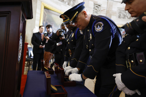 Capitol Police officers display the Congressional Gold Medal ahead of the ceremony for United States Capitol Police and the Washington D.C Metropolitan Police officers who protected the U.S. Capitol Building on January 6th, in the Rotunda today in Washington, D.C.