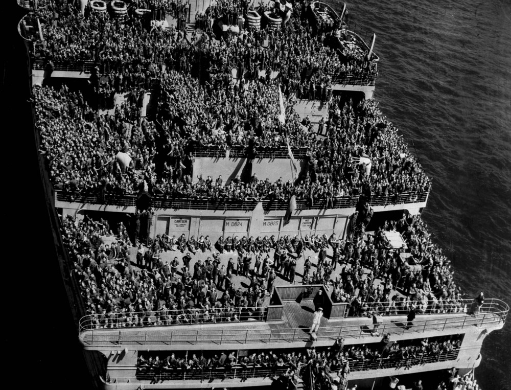 On this date in 1945: U.S. troops return from Europe aboard the British luxury liner-turned-troopship HMS Queen Mary. The ship sailed into New York Harbor with 14,000 troops aboard on its first voyage to America since V-E Day. 
