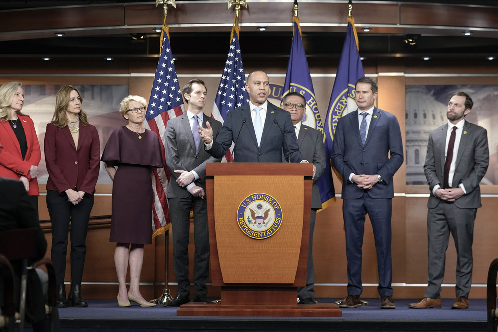 House Minority Leader Hakeem Jeffries, D-N.Y., center, speaks during a news conference on national security legislation on Capitol Hill Tuesday, Feb. 13, 2024, in Washington. (AP Photo/Mariam Zuhaib)