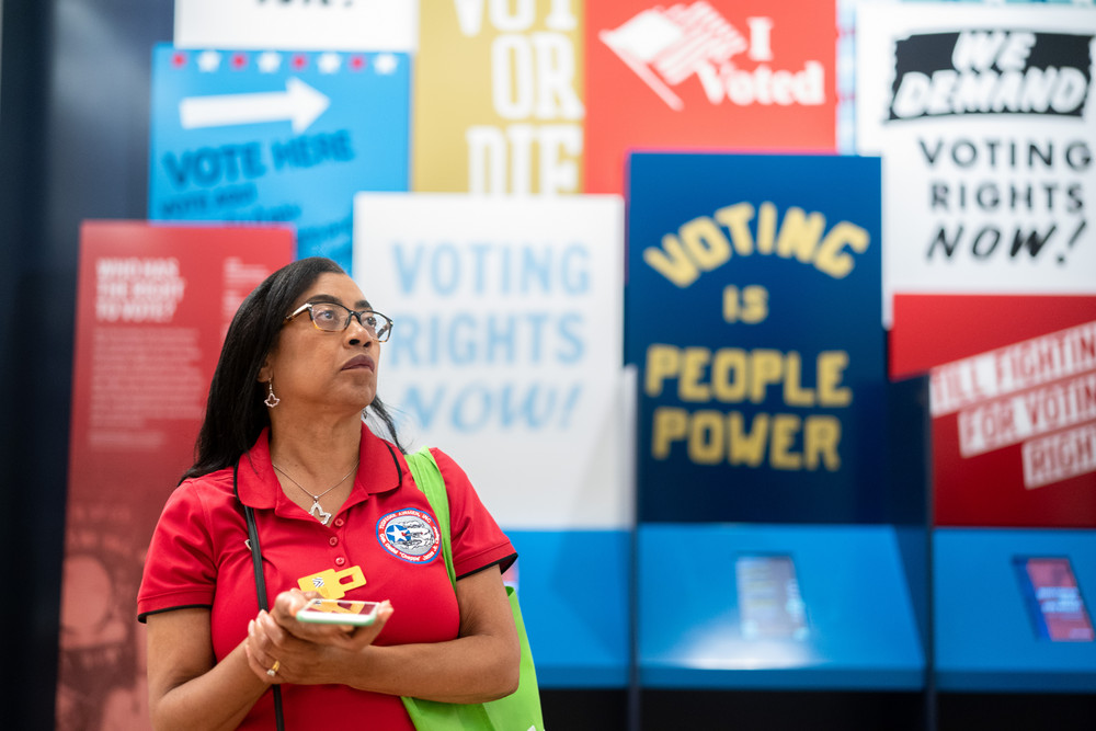 A woman walks through an exhibit on voting rights at the International African American Museum in Charleston, South Carolina.