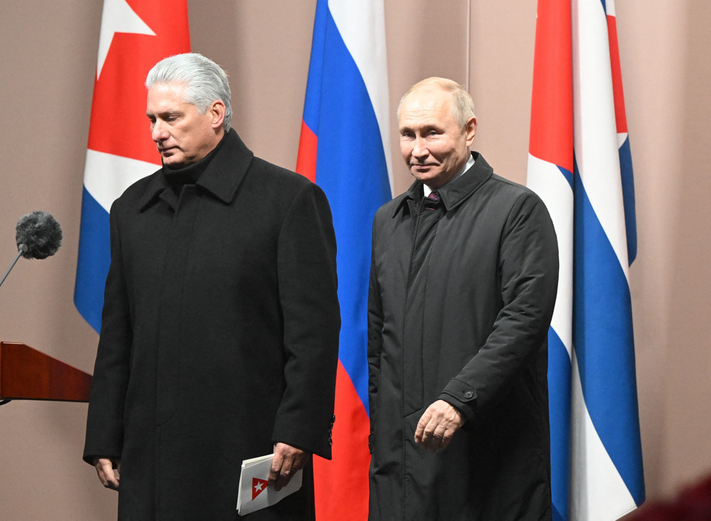 Cuban President Miguel Diaz-Canel Bermudez and Russian President Vladimir Putin leave after the inauguration of a monument to late Cuban leader Fidel Castro in Moscow on November 22, 2022.