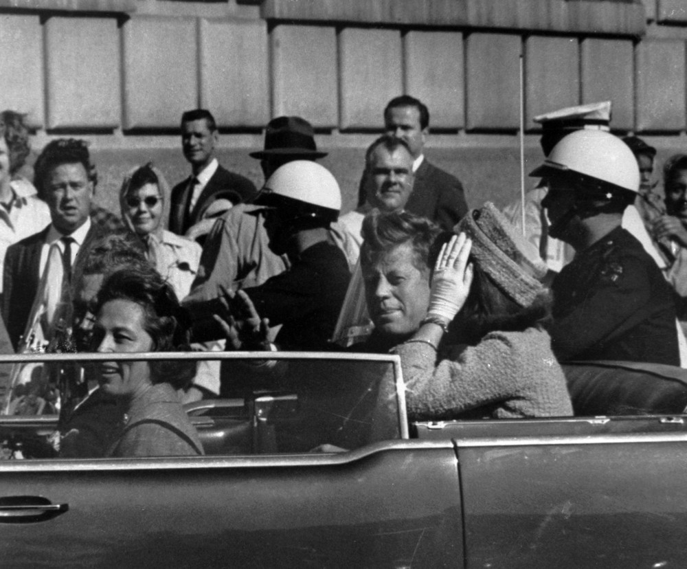 On this date in 1963: President John F. Kennedy is assassinated in Dallas. He's seen in this photo riding in his motorcade approximately one minute before he was shot with Jacqueline Kennedy, Nellie Connally and her husband, Gov. John Connally of Texas.
