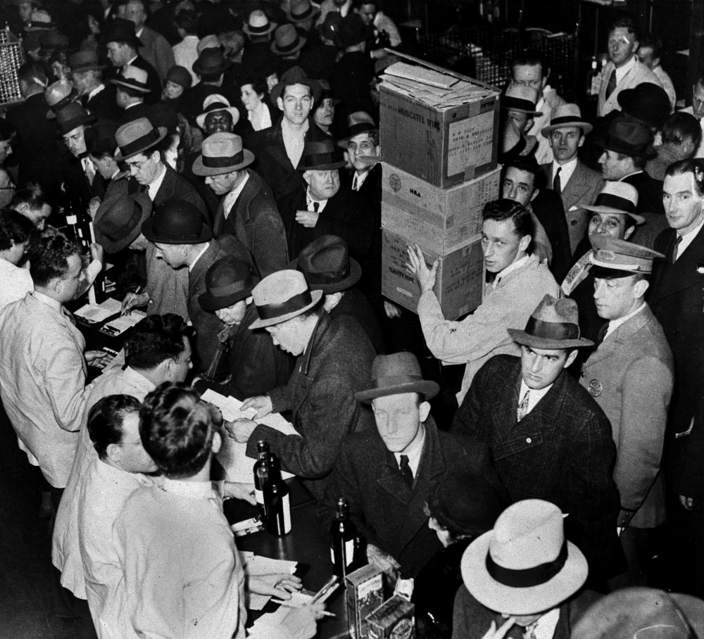 On this date in 1933: The prohibition repeal was ratified. The day of, wholesale houses delivered alcohol to anxious consumers, pictured here in New York, with a shipment from the historic winery Mouquin in Brooklyn. 