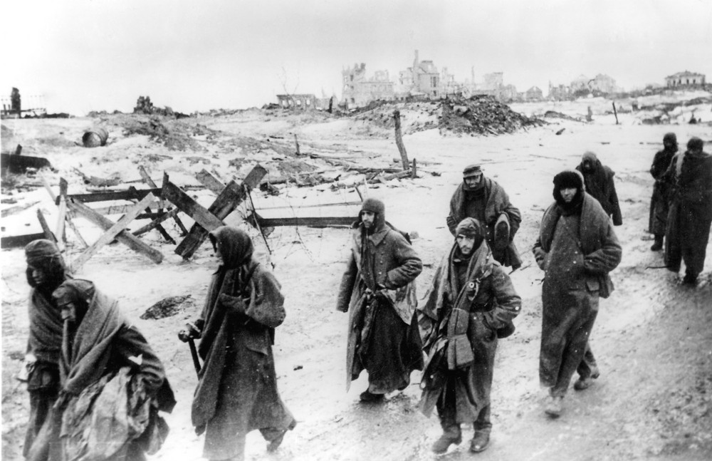On this date in 1943: The Battle of Stalingrad, a major battle in World War II, ends with Russian victory. In this early 1943 photo, captured German soldiers, their uniforms tattered from the battle, make their way in the bitter cold through the ruins of Stalingrad.
