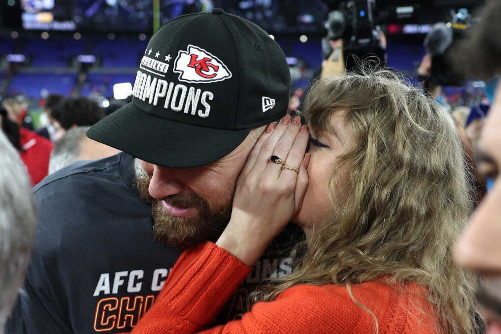 Travis Kelce of the Kansas City Chiefs celebrates with Taylor Swift after a 17-10 victory against the Baltimore Ravens in the AFC Championship Game. 
