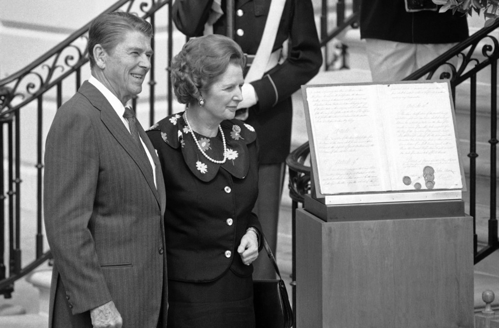 On this date in 1983: President Ronald Reagan and British Prime Minister Margaret Thatcher stand next to an original copy of the 1783 Treaty of Paris after their meeting at the White House. The Treaty of Paris ended the Revolutionary War in America. 