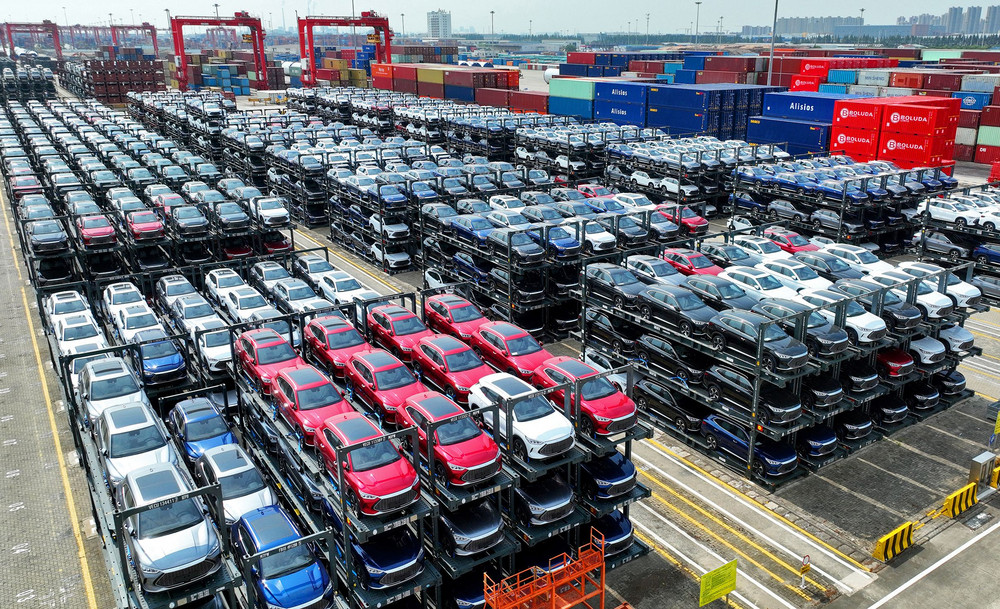 Electric cars waiting to be loaded on a ship are stacked at the international container terminal of Taicang Port at Suzhou Port, in China's eastern Jiangsu Province. 