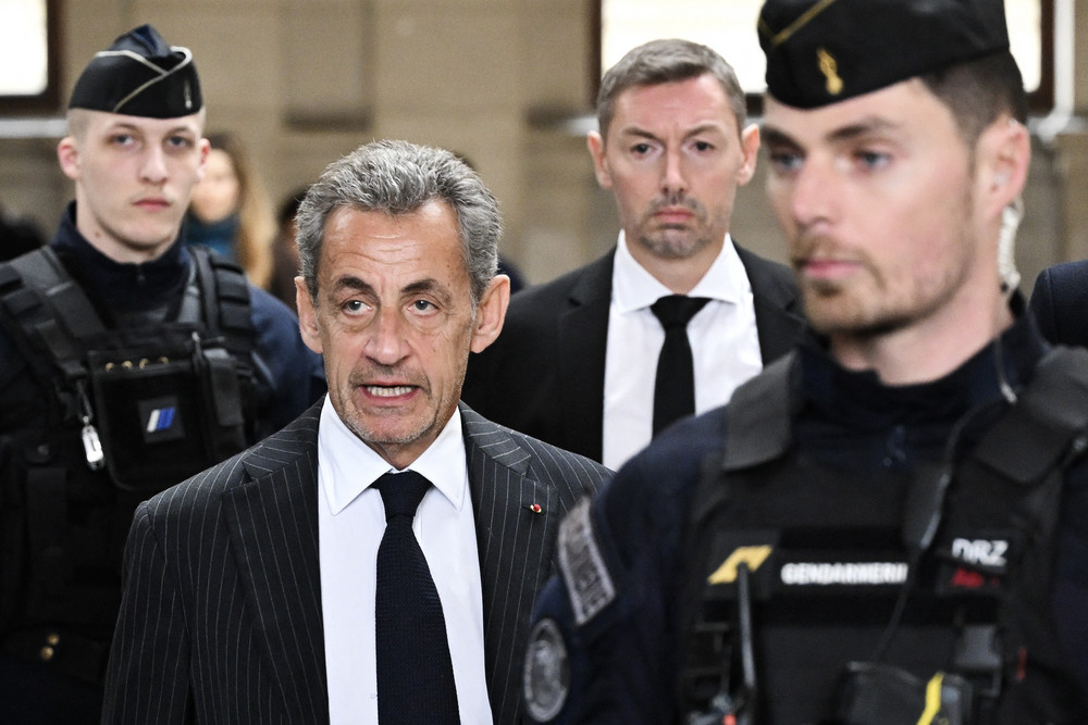 France's former president Nicolas Sarkozy arrives for the verdict in his appeal trial in Paris.