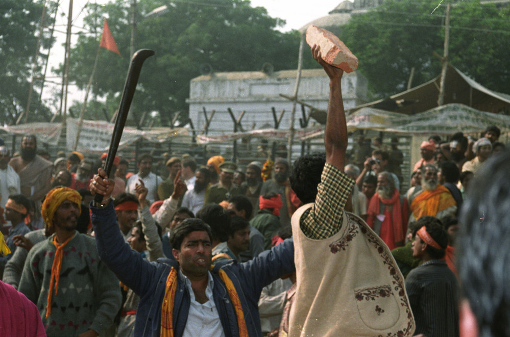 On this date in 1992: A militant Hindu fundamentalist holds a brick and another one holds a sword as thousands storm the Babri mosque in Ayodhya, India. Thousands of militants razed the 430-year old Muslim mosque to clear the site for a proposed Hindu temple. The incident resulted in several months of nationwide Hindu-Muslim violence in the country, causing the death of at least 2,000. 
