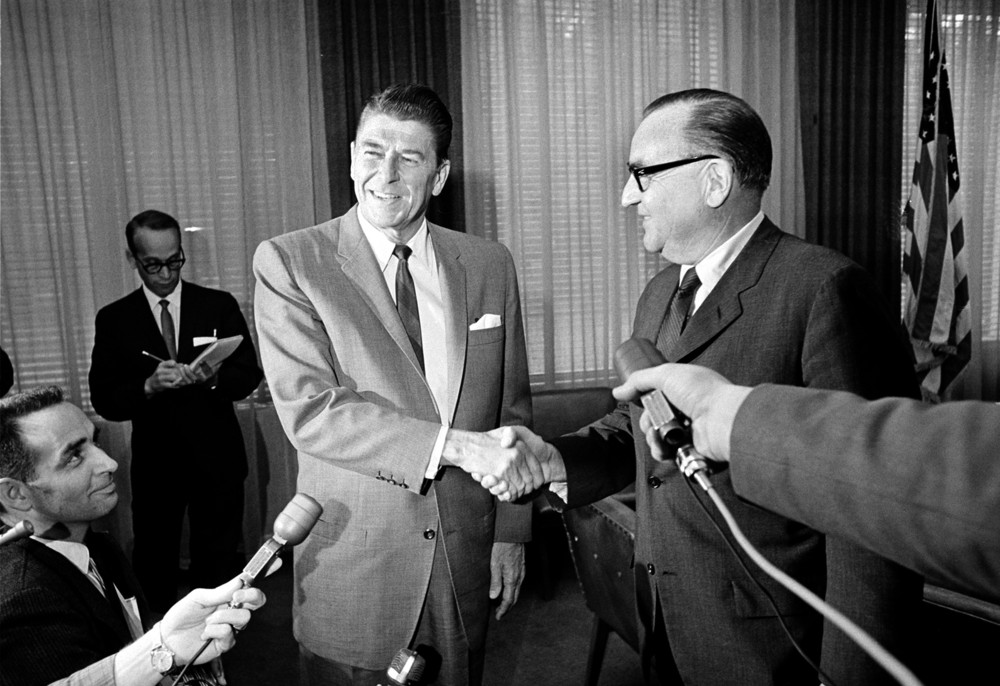 On this date in 1966: California's Democratic then-Gov. Edmund G. Brown (right) and Republican then-governor-elect Ronald Reagan shake hands at their meeting in Brown's office at the Capitol building in Sacramento. This was their first meeting since Reagan's landslide victory over Brown in the gubernatorial election.