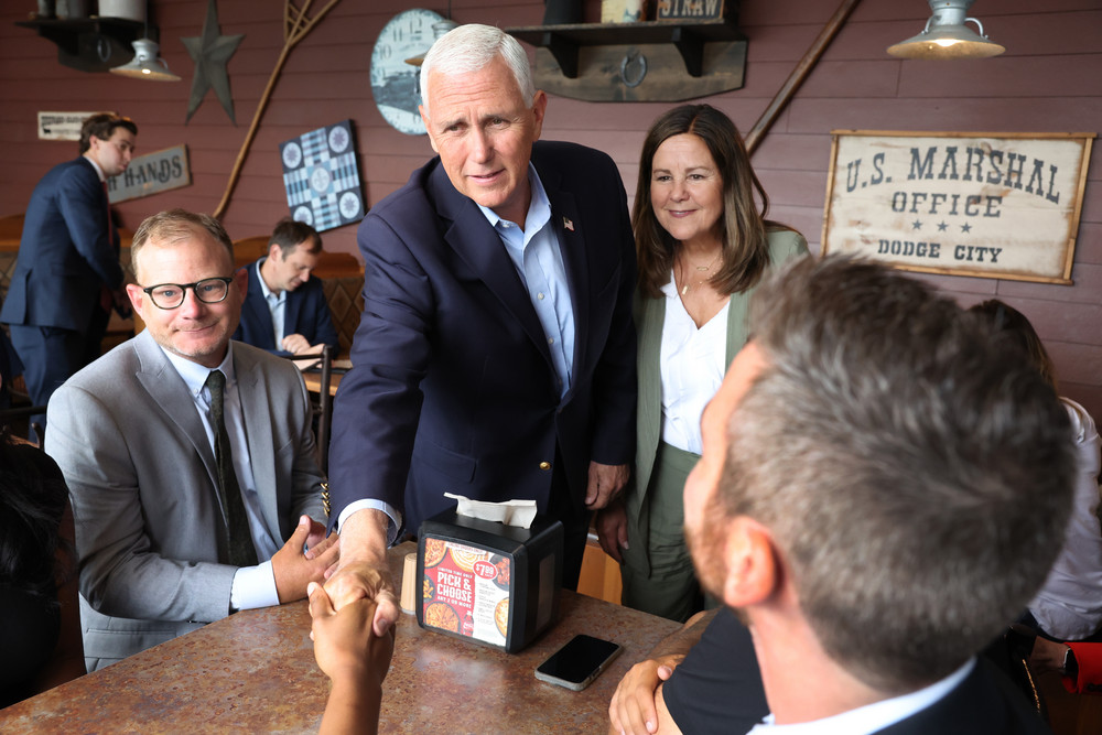 Former Vice President Mike Pence and his wife Karen greet supporters during a visit to a Pizza Ranch restaurant on June 8 in Waukee, Iowa. 