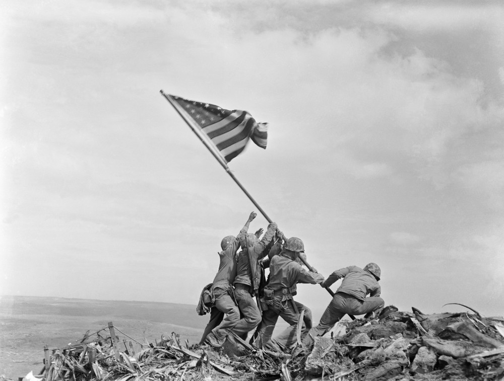On this date in 1945: U.S. Marines of the 28th Regiment, 5th Division, raise a U.S. flag atop Mt. Suribachi in Iwo Jima, Japan.