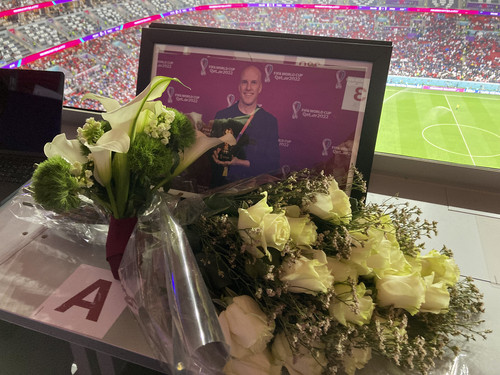 A tribute to journalist Grant Wahl is seen on his previously assigned seat at the World Cup quarterfinal soccer match between England and France.