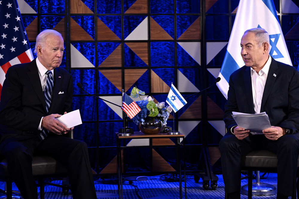 President Joe Biden listens on as Israel's Prime Minister Benjamin Netanyahu reads a statement before a meeting in Tel Aviv.