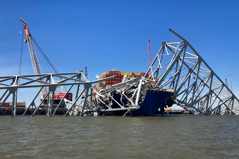 The wreckage of the cargo ship Dali and the collapsed Francis Scott Key Bridge is seen.