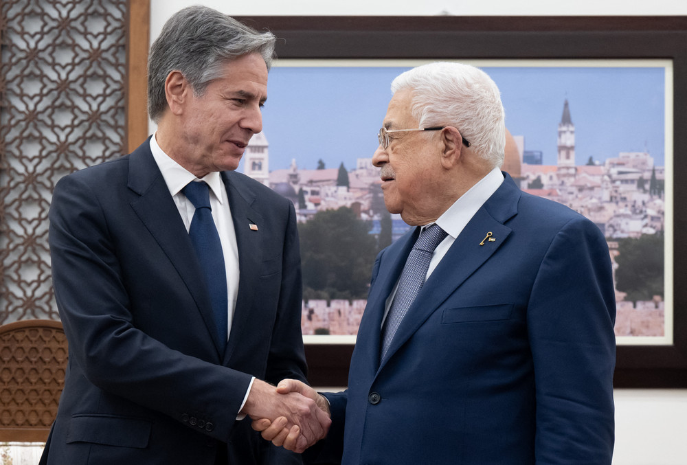 Palestinian Authority President Mahmoud Abbas and U.S. Secretary of State Antony Blinken shake hands prior to a meeting at the presidential compound in the West Bank city of Ramallah. 