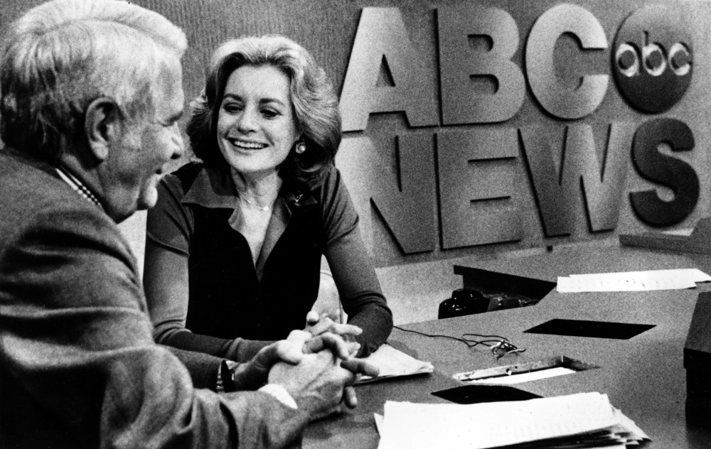 On this date in 1976: A smiling Barbara Walters chats with co-host Harry Reasoner following her debut as the nation's first female network news anchor on ABC's evening news program in New York. 