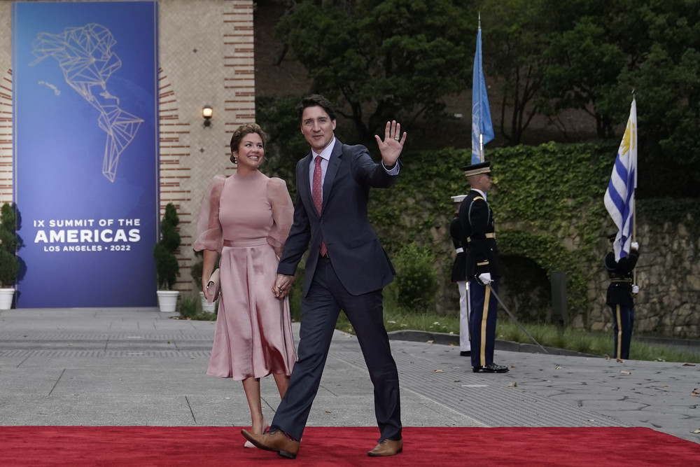 Canadian Prime Minister Justin Trudeau and his wife, Sophie Gregoire Trudeau, are pictured waving in the direction of the camera.