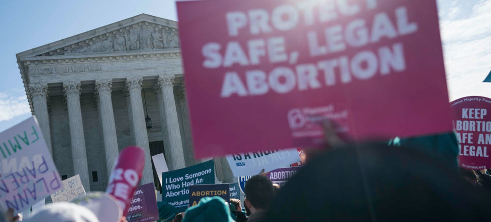 Reproductive rights advocates, right, face off against anti-abortion demonstrators, left, during a rally at the Supreme Court on March 2, 2016. (photo: Getty)