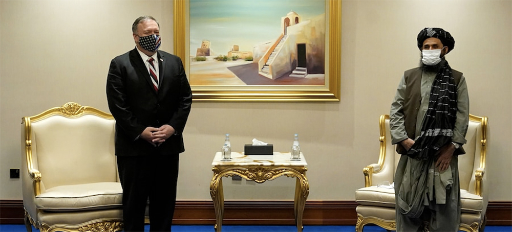 Then-Secretary of State Mike Pompeo meets with Abdul Ghani Baradar, head of the Taliban's peace negotiation team, on Nov. 21, 2020. (photo: Patrick Semansky/AP)