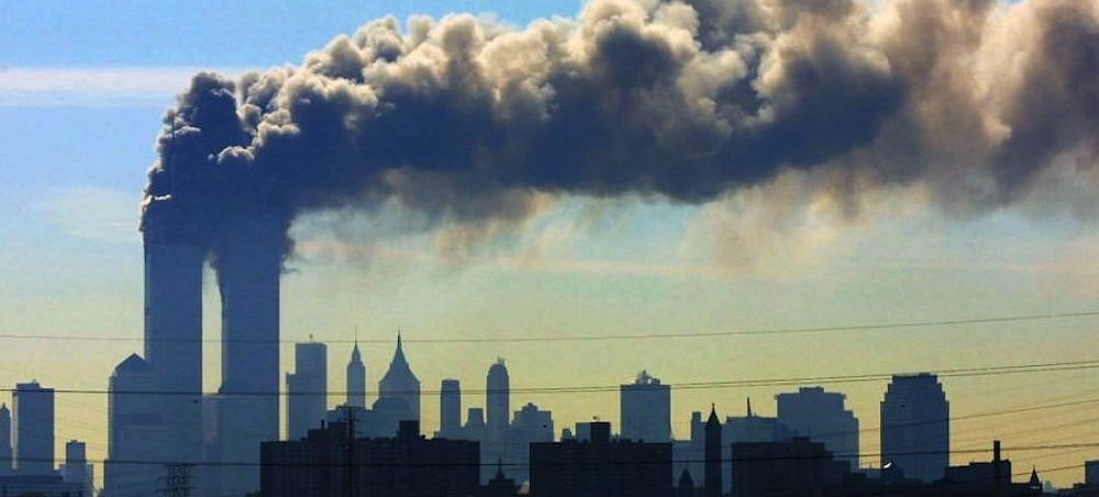 Smoke billows from the twin towers of the World Trade Center in New York. (photo: Gene Boyars/AP)