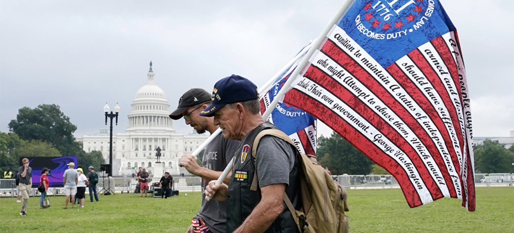 People arrive to attend a rally near the U.S. Capitol in Washington, Saturday, Sept. 18, 2021. The rally was planned by allies of former President Donald Trump and aimed at supporting the so-called 'political prisoners' of the Jan. 6 insurrection at the Capitol. (photo: Alex Brandon/AP)