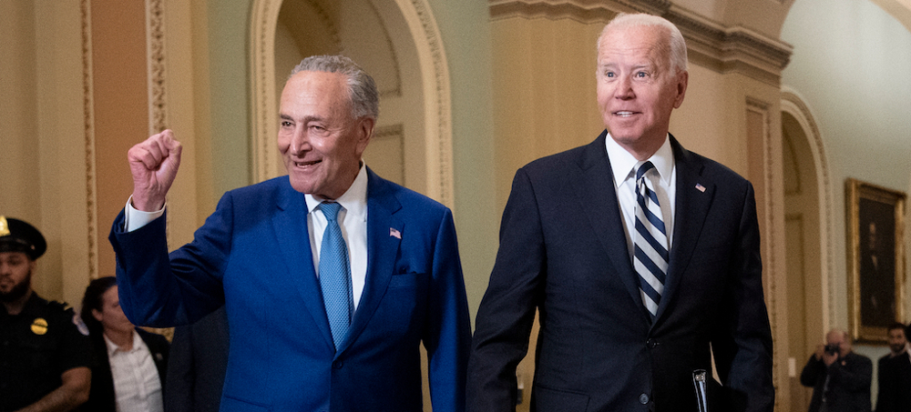 President Joe Biden walks with Senate Majority Leader Chuck Schumer at the Capitol in Washington, D.C., as he arrives to discuss the latest progress on his infrastructure bill. (photo: Caroline Brehman/Getty)