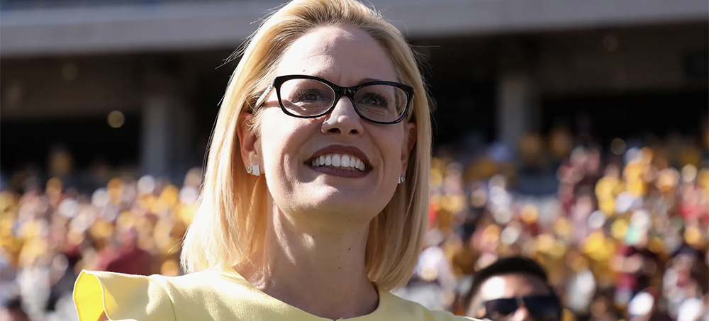 Kyrsten Sinema participates in a coin toss at an Arizona State football game on November 3, 2018. (photo: Christian Petersen/Getty Images)