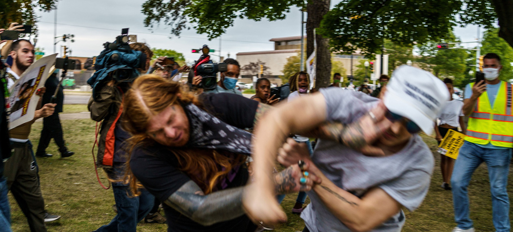 A protester scuffles with a Trump supporter (R) in Kenosha, Wisconsin, on Sept. 1 amid ongoing demonstrations after the shooting by police of Jacob Blake. (photo: Kerem Yucel/Getty)