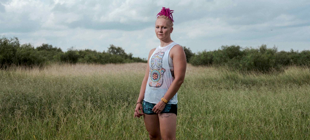 Reality Winner, a former intelligence analyst contracted by the NSA, posed for a portrait in the field behind her mother's home where she is serving a home confinement sentencing by the federal courts in Kingsville, Texas. (photo: Christopher Lee/Redux)