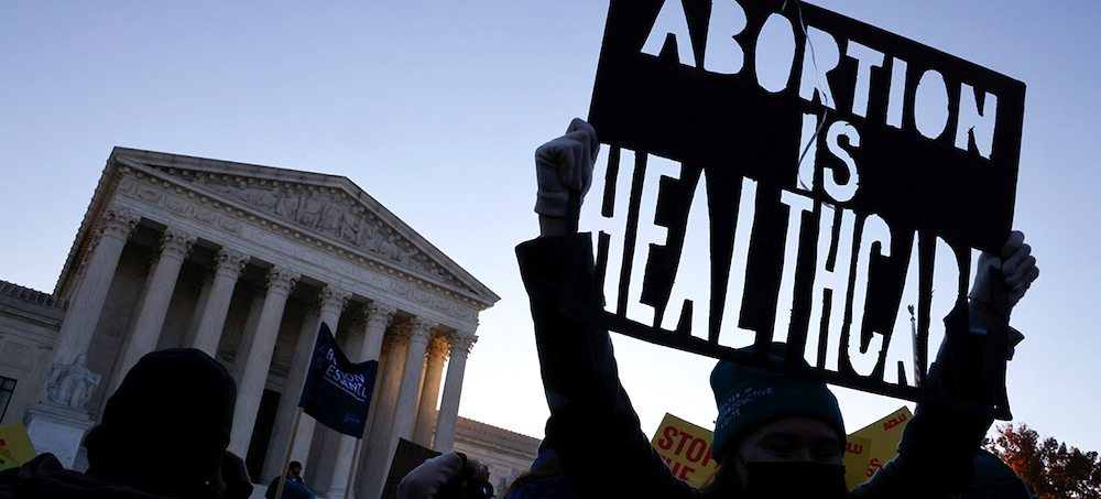 Pro-abortion rights activists protest outside the Supreme Court building, ahead of arguments in the Mississippi abortion rights case Dobbs v. Jackson Women's Health, in Washington, December 1, 2021. (photo: Jonathan Ernst/Reuters)